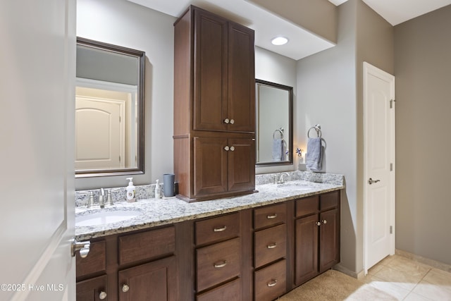 bathroom featuring tile patterned floors and vanity