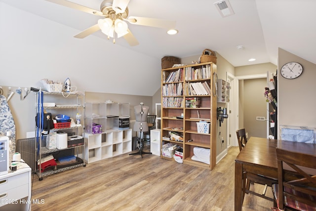 office area featuring light hardwood / wood-style flooring, ceiling fan, and lofted ceiling