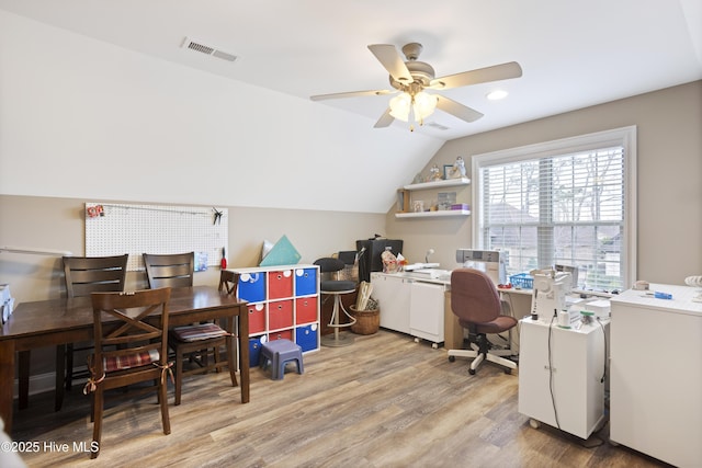 office space with ceiling fan, light hardwood / wood-style floors, and lofted ceiling