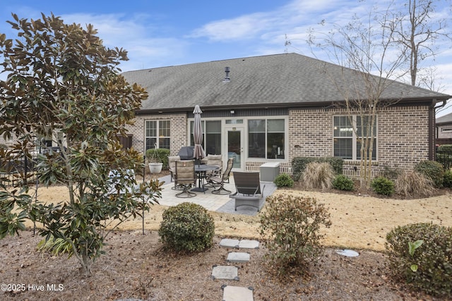 back of property with a patio