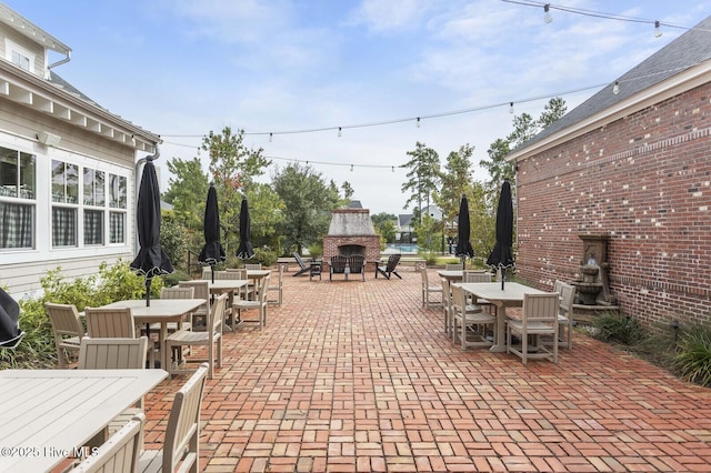 view of patio featuring an outdoor fireplace