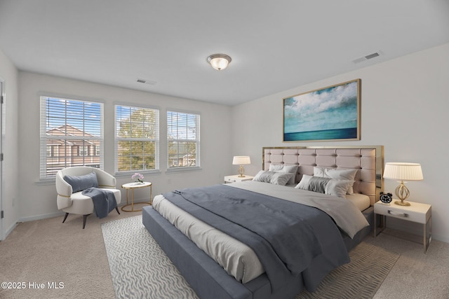 bedroom featuring carpet, visible vents, and baseboards