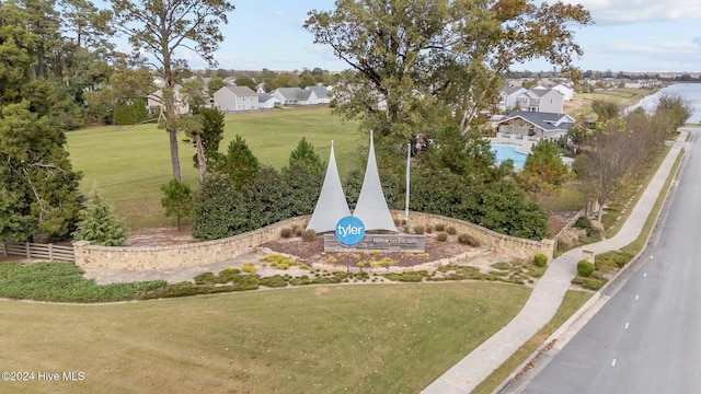 view of home's community with a residential view and a yard