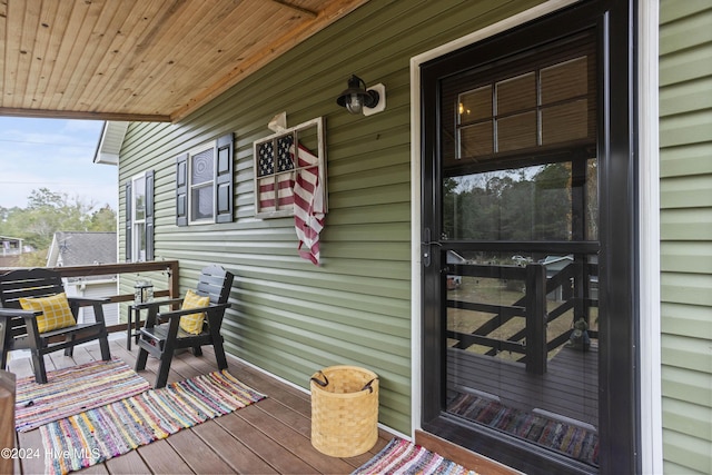 wooden terrace with a porch