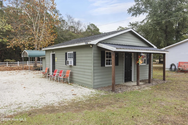 view of front of house featuring cooling unit