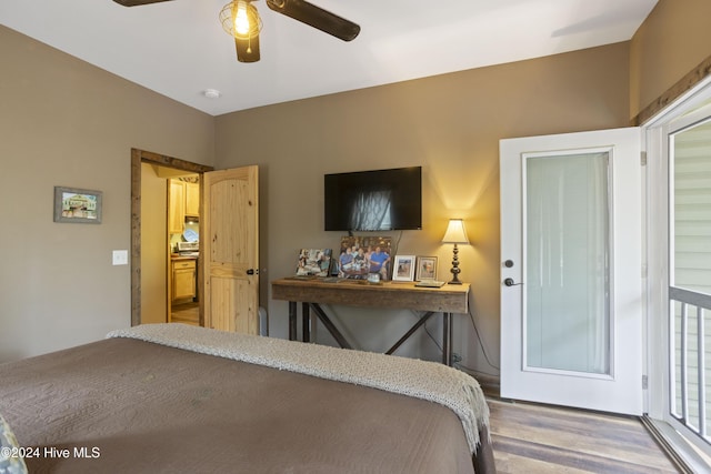 bedroom with hardwood / wood-style floors and ceiling fan