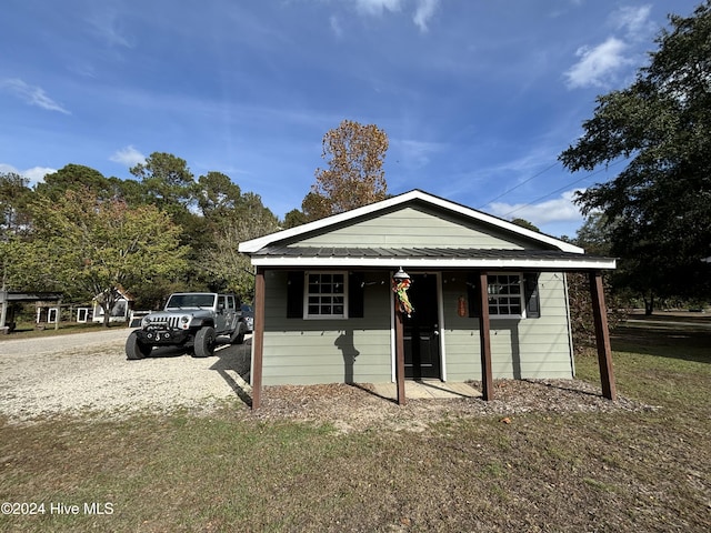 bungalow with a front lawn