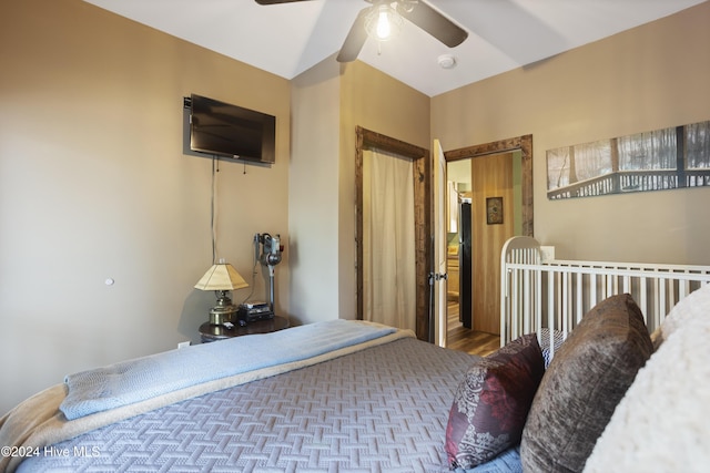 bedroom with ceiling fan and hardwood / wood-style flooring