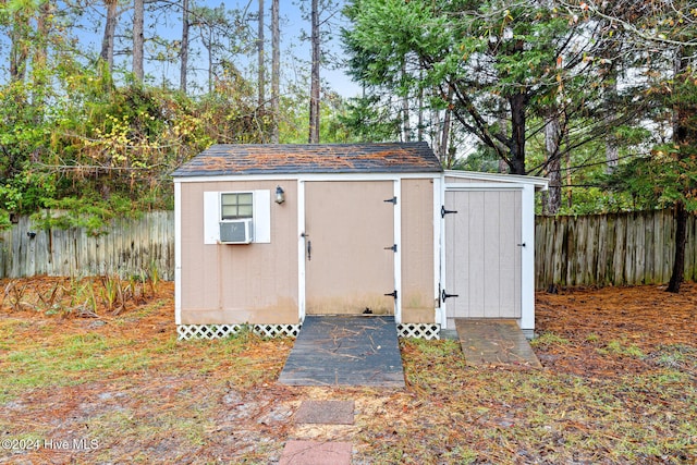 view of outbuilding with cooling unit