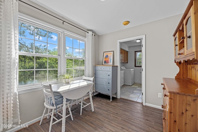 212 Outrigger Rd, New Bern, NC 28562 - dining area with washer and dryer, dark wood-type flooring, and baseboards