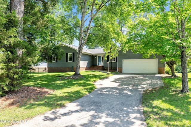 212 Outrigger Rd, New Bern, NC 28562 - single story home with driveway, a front lawn, and an attached garage