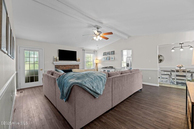 212 Outrigger Rd, New Bern, NC 28562 - living room featuring dark wood-type flooring, ceiling fan, and a brick fireplace