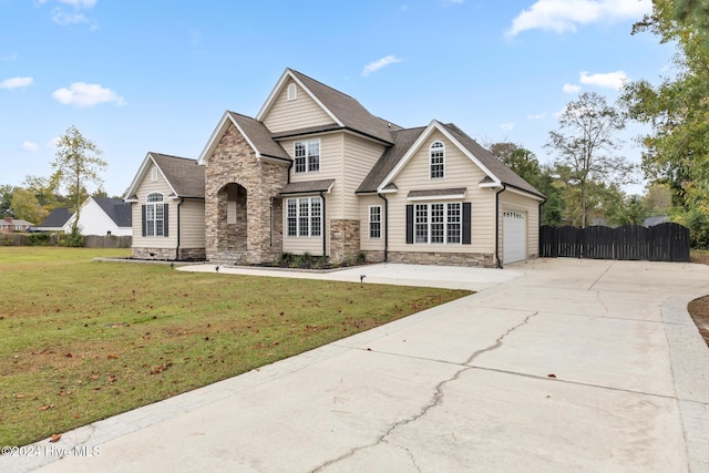 view of front of home featuring a garage and a front yard