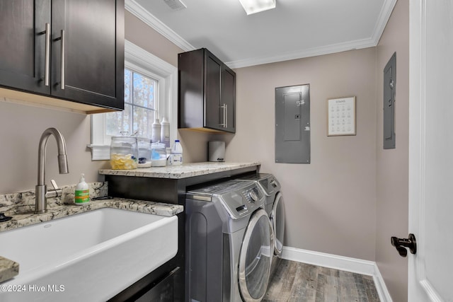 washroom with electric panel, crown molding, sink, and washer and clothes dryer