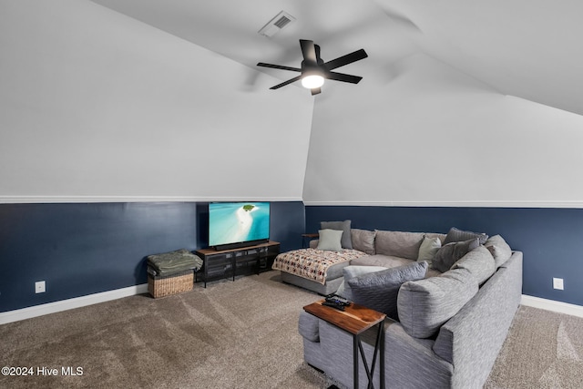 carpeted living room with ceiling fan and lofted ceiling