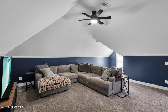 carpeted living room with lofted ceiling and ceiling fan