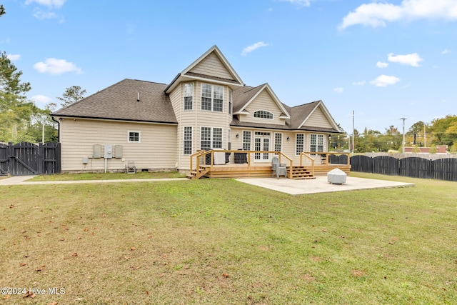 back of house featuring a patio and a yard