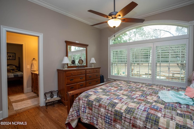 bedroom featuring ceiling fan, ornamental molding, and light wood-type flooring