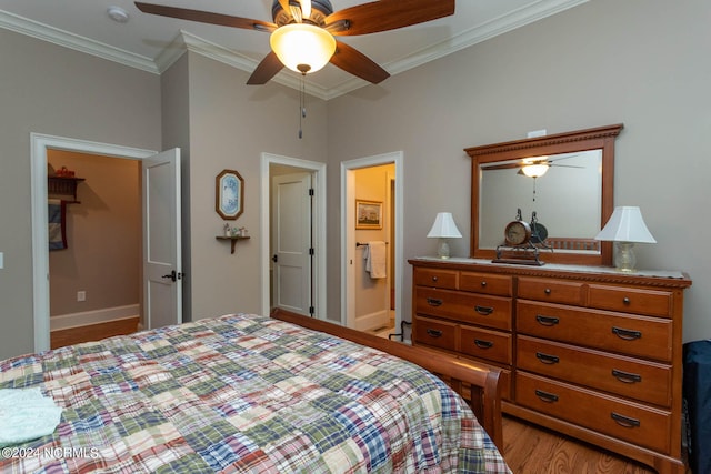 bedroom featuring light wood-type flooring, connected bathroom, ceiling fan, and ornamental molding