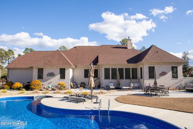 view of swimming pool with a patio