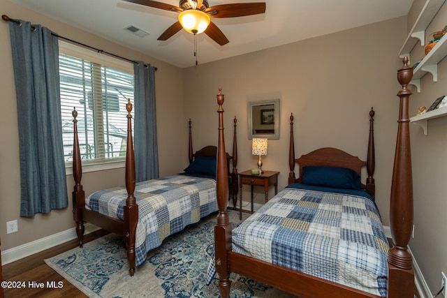 bedroom featuring ceiling fan and dark wood-type flooring