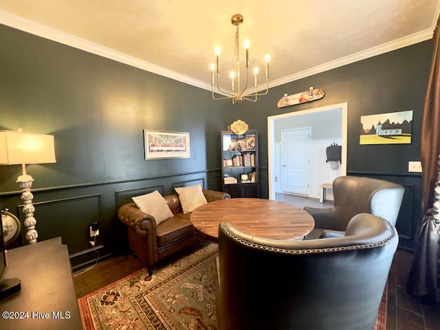 living room featuring crown molding, a notable chandelier, and dark hardwood / wood-style flooring