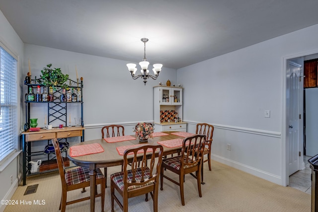 dining room with a notable chandelier