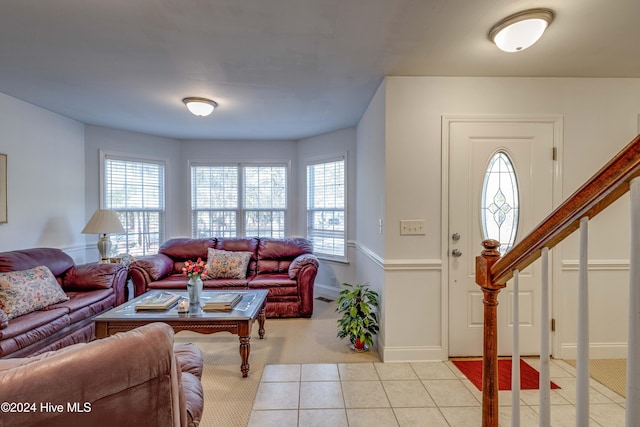 living room with light tile patterned flooring