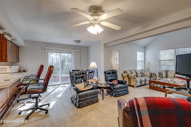 tiled living room with ceiling fan