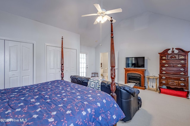 bedroom featuring multiple closets, high vaulted ceiling, ceiling fan, and carpet floors