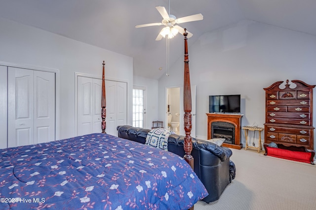 74 Driftwood Ct, Arapahoe, NC 28510 - bedroom with multiple closets, carpet flooring, a fireplace, ceiling fan, and high vaulted ceiling