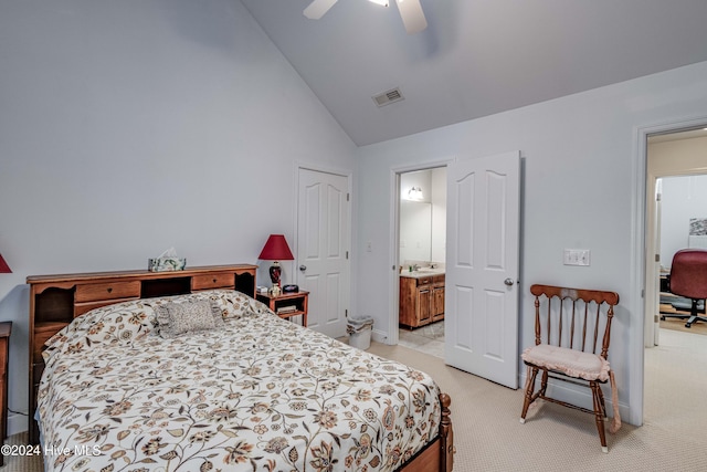 bedroom with ceiling fan, ensuite bath, light carpet, and high vaulted ceiling