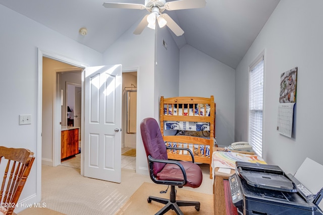 office with ceiling fan, light carpet, and vaulted ceiling