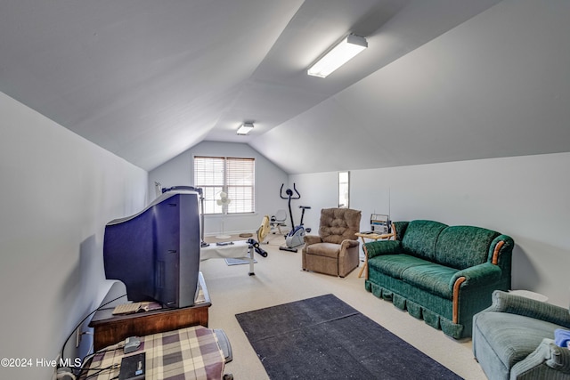 interior space featuring lofted ceiling and carpet