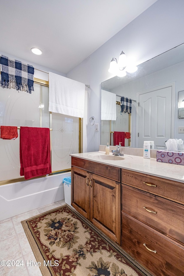 bathroom featuring vanity, tile patterned floors, and shower / bathtub combination