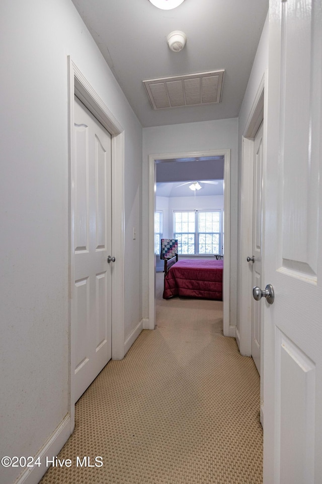 74 Driftwood Ct, Arapahoe, NC 28510 - hallway with baseboards and light colored carpet