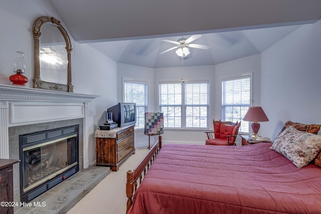 74 Driftwood Ct, Arapahoe, NC 28510 - bedroom featuring vaulted ceiling, carpet, a tile fireplace, baseboards, and ceiling fan