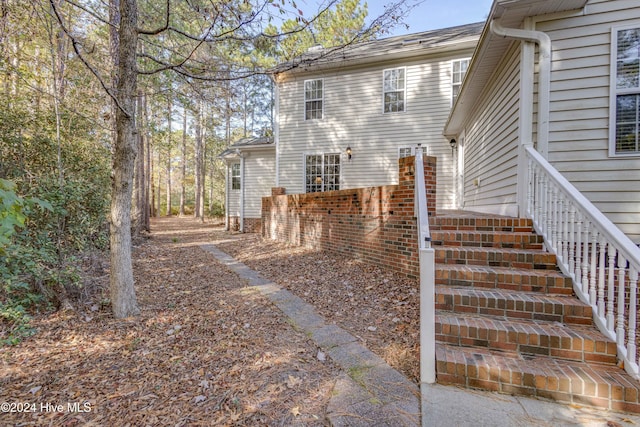 74 Driftwood Ct, Arapahoe, NC 28510 - doorway to property with roof with shingles