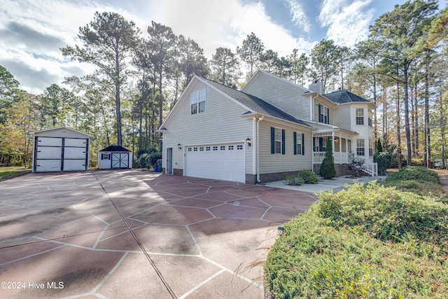 view of front of property featuring a storage unit and covered porch