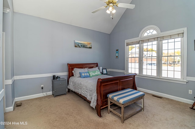 carpeted bedroom featuring ceiling fan and high vaulted ceiling