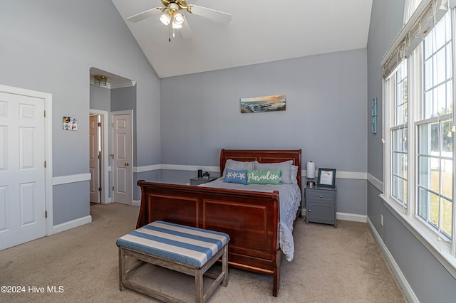 carpeted bedroom featuring ceiling fan and high vaulted ceiling