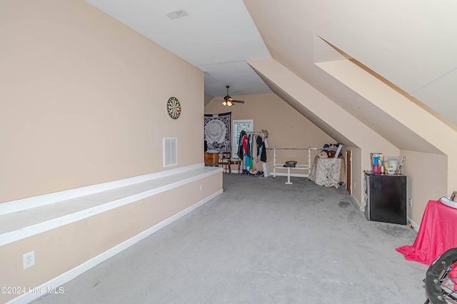 bonus room featuring ceiling fan and carpet