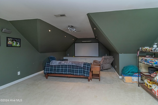 carpeted bedroom with vaulted ceiling