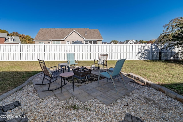 view of patio with a fire pit