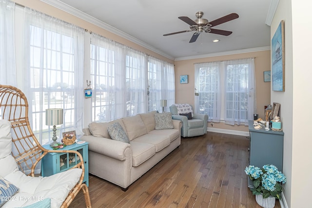 sunroom featuring ceiling fan