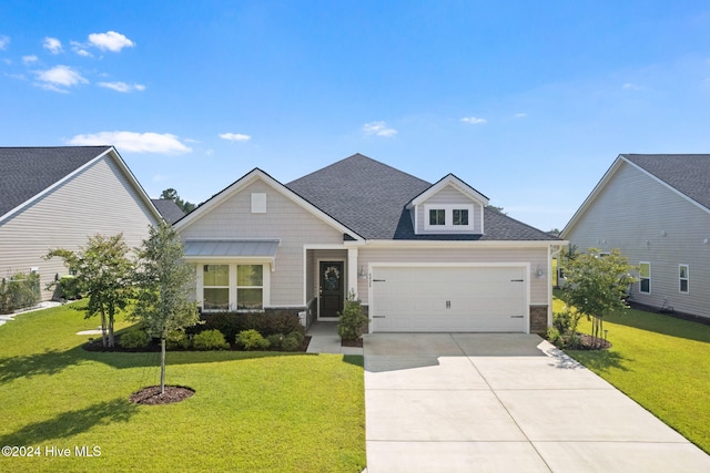 craftsman inspired home featuring a front yard and a garage