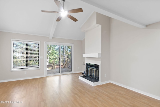 unfurnished living room with vaulted ceiling with beams, ceiling fan, and light hardwood / wood-style floors