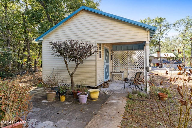 view of side of property featuring a patio area