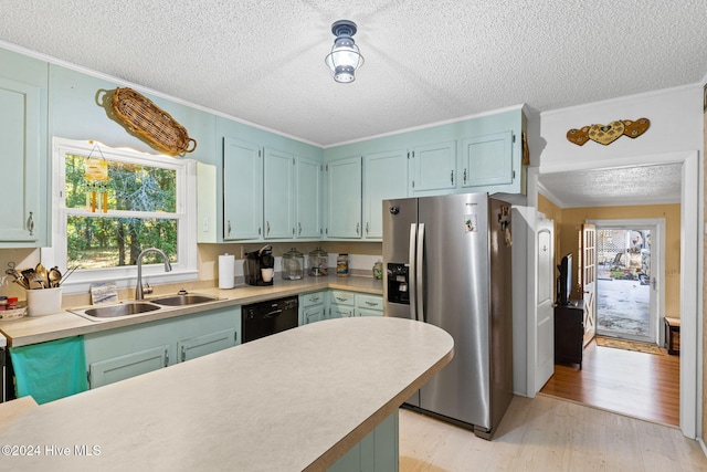 kitchen featuring light hardwood / wood-style floors, black dishwasher, stainless steel refrigerator with ice dispenser, sink, and ornamental molding