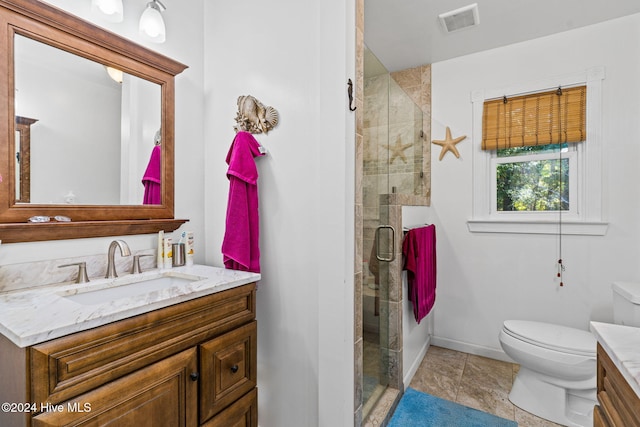 bathroom with an enclosed shower, vanity, and toilet